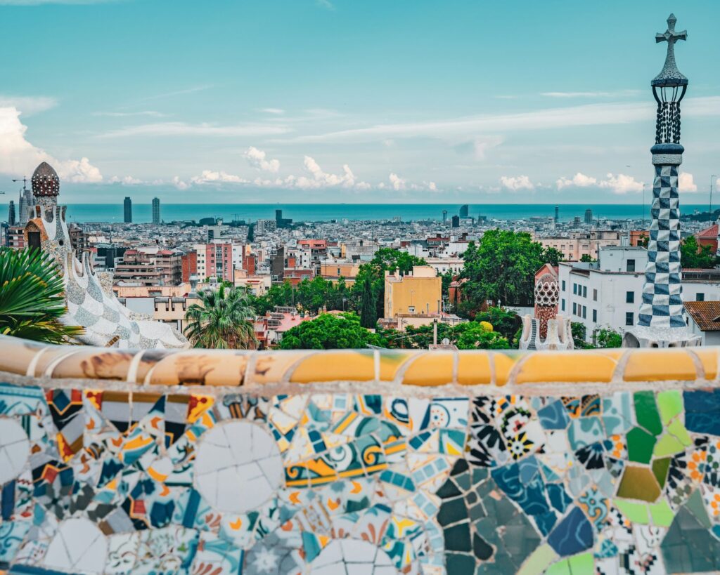 View of Barcelona’s Sagrada Família with detailed spires rising above the city skyline.