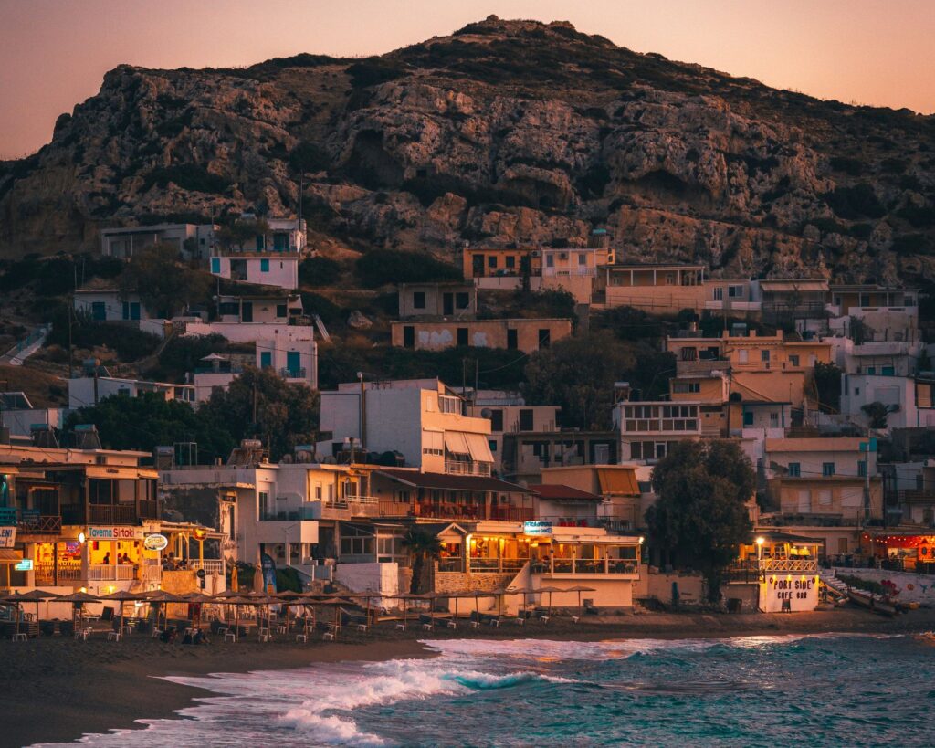 Turquoise water and pink‑tinted sand at Elafonisi Beach in Crete, Greece.